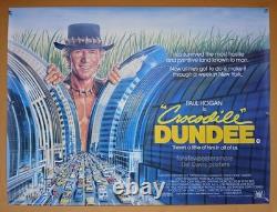 CROCODILE DUNDEE (1986) rare ROLLED original UK quad poster Daniel Gouzee art