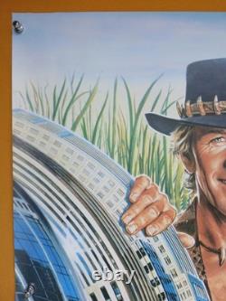 CROCODILE DUNDEE (1986) rare ROLLED original UK quad poster Daniel Gouzee art