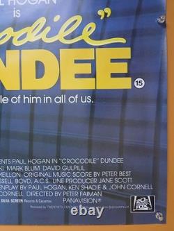CROCODILE DUNDEE (1986) rare ROLLED original UK quad poster Daniel Gouzee art
